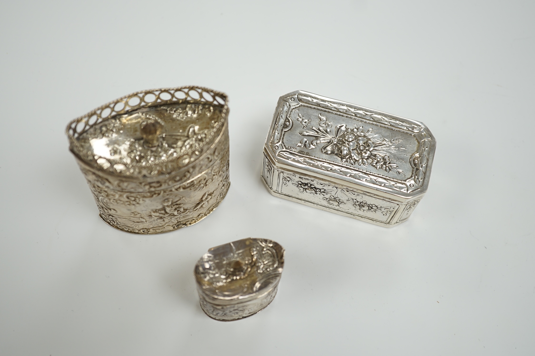 Three assorted late 19th century Dutch white metal boxes, largest 80mm.